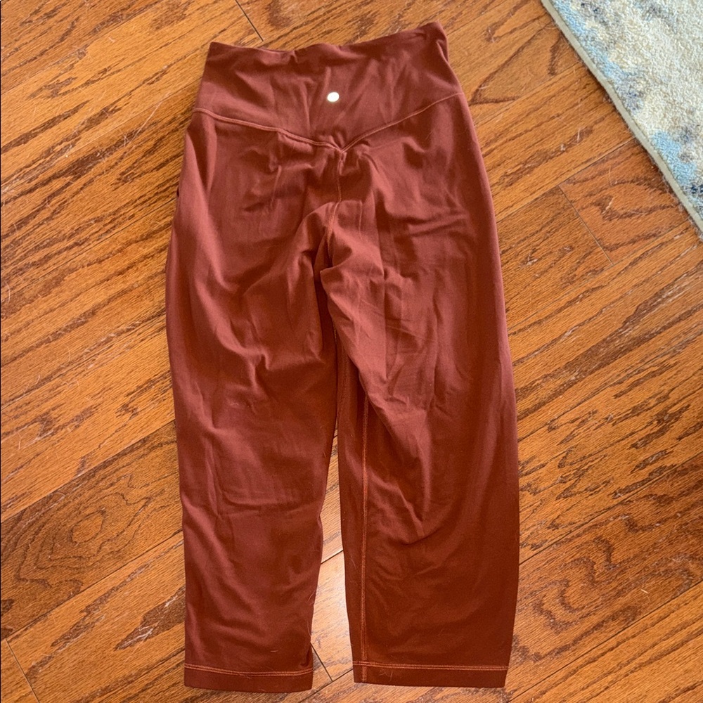 Lululemon women’s size medium calf leggings with pockets salmon color